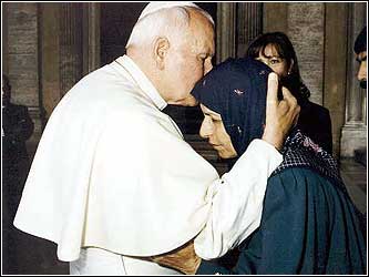 Pope John Paul embraces the mother of Agca, Muzeyen